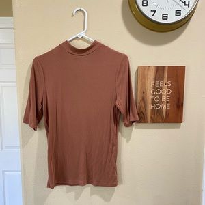 Cute, ribbed, and stretchy blouse. Size medium.